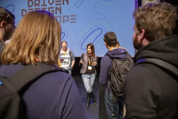 Community members in the hallway track at a DDD conference